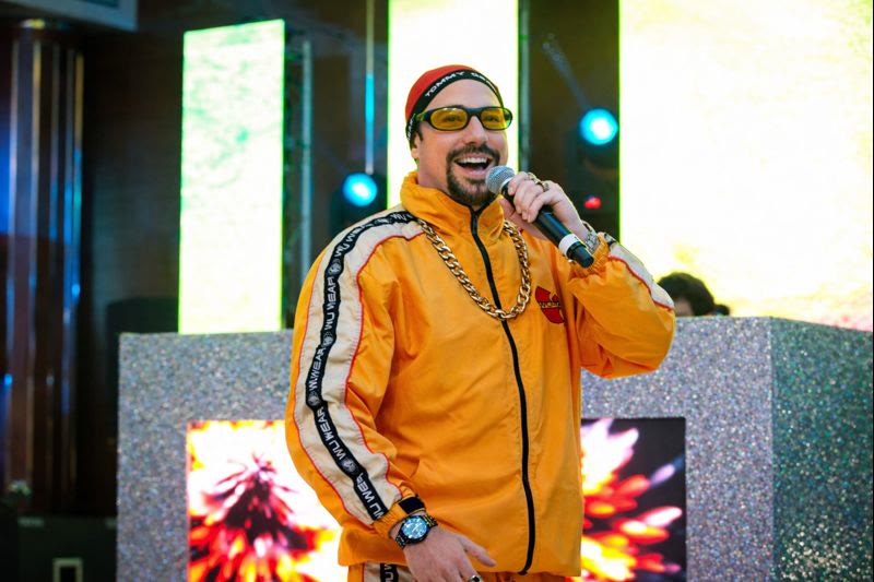 Ali G on stage with microphone